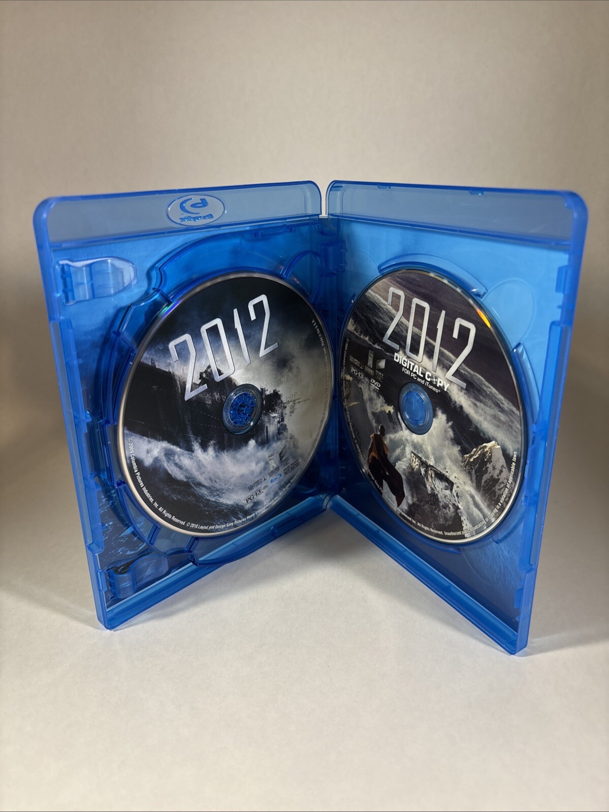 2012 Blu-ray (2-Disc Set) – Great Condition – Shipped by Box – Tested