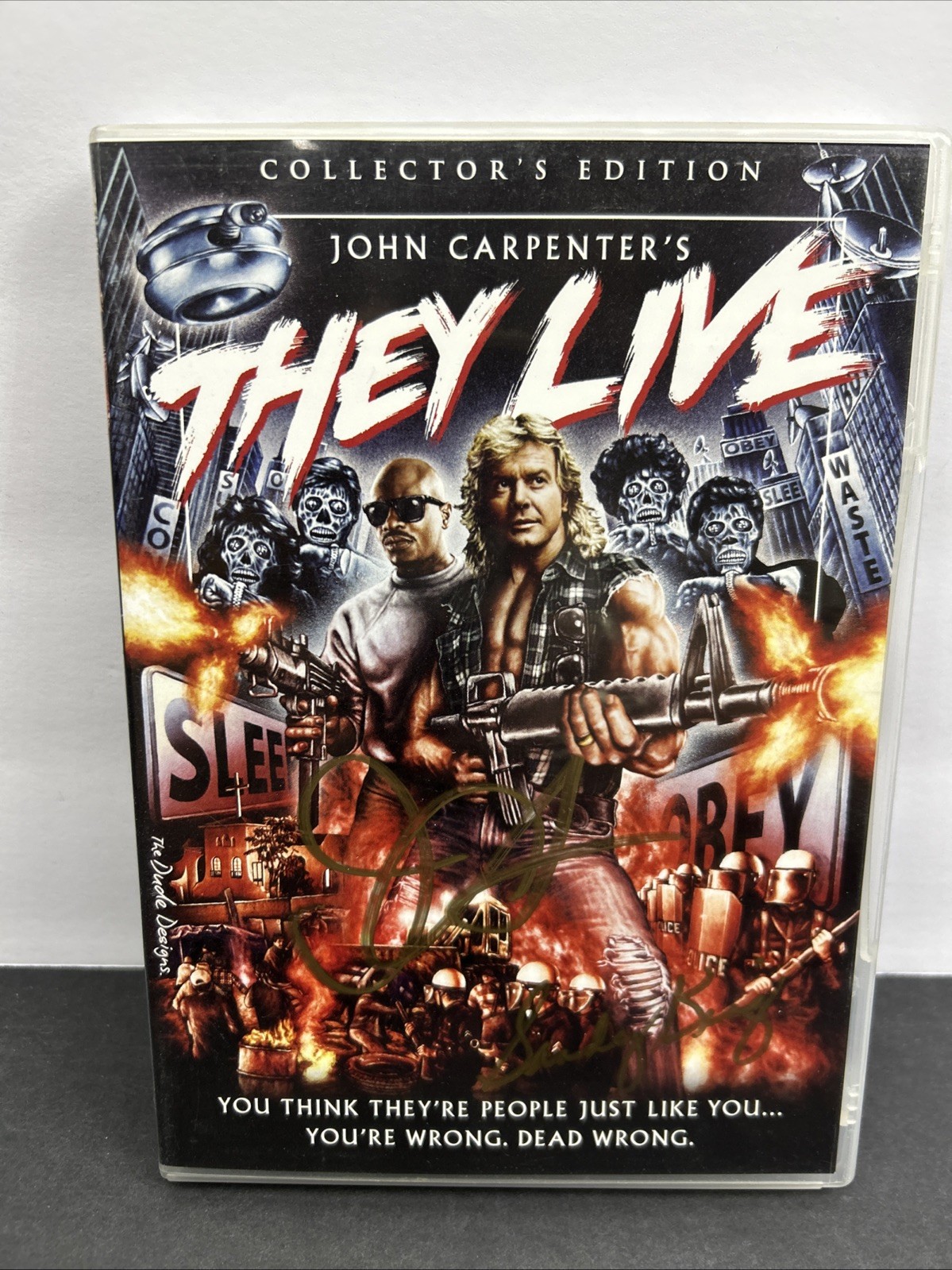 THEY LIVE DVD SIGNED BY DIRECTOR JOHN CARPENTER & PRODUCER SANDY KING
